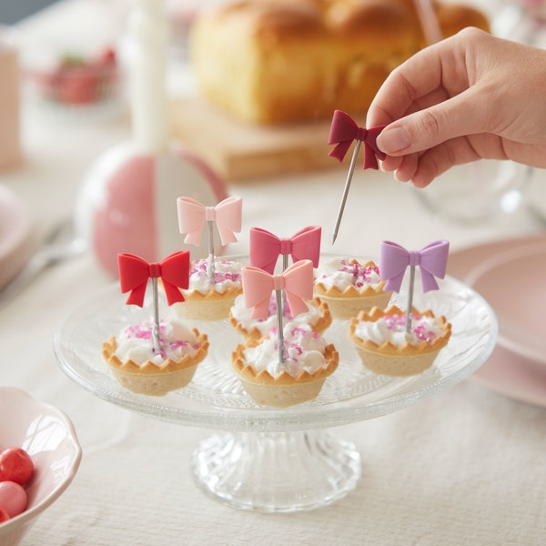 Balvi Tenedor aperitivo Coquette 6 pinchos con forma de lazos de color Inox/silicona